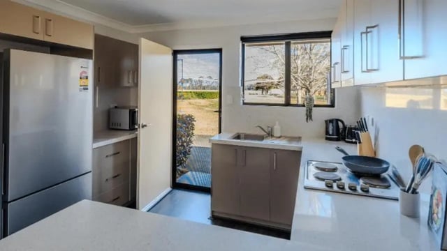 Stainless steel fridge microwave sink stove kitchen at Western Sydney University Hawkesbury Village in Sydney Student Accommodation