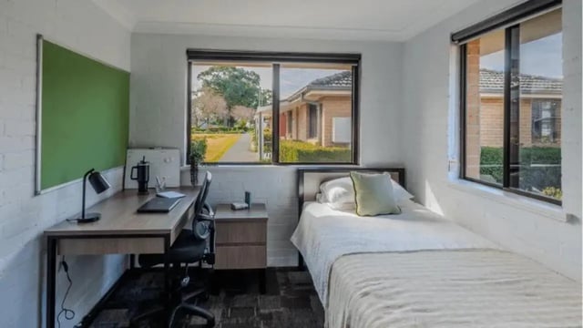 Desk bed with green board and chair bedroom at Western Sydney University Hawkesbury Village in Sydney Student Accommodation
