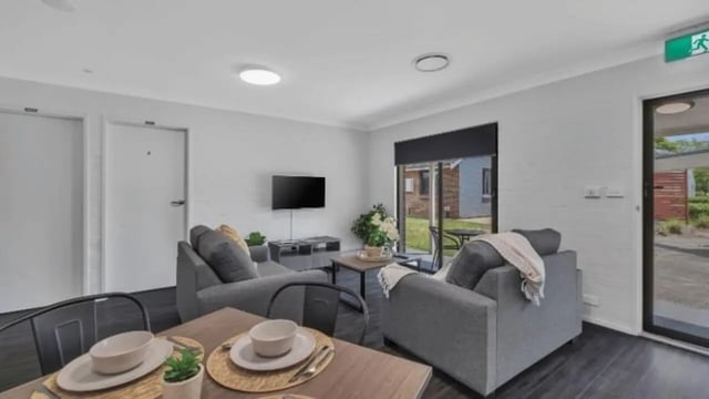 Sofa TV dining table living room at Western Sydney University Hawkesbury Village in Sydney Student Accommodation