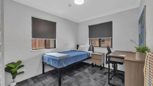 Bed desk and nightstand Bedroom at Western Sydney University Hawkesbury Village in Sydney Student Accommodation