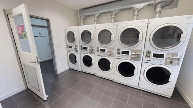 Stackable white washers and dryers laundry room at Western Sydney University Hawkesbury Village in Sydney Student Accommodation
