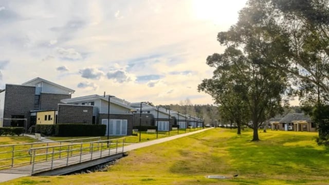 Modern brick student housing complex with pathway exterior at Western Sydney University Hawkesbury Village in Sydney Student Accommodation