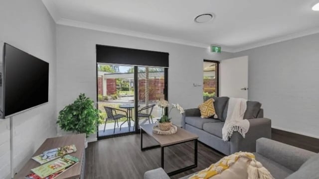 Sofa television coffee table plant living room at Western Sydney University Hawkesbury Village in Sydney Student Accommodation