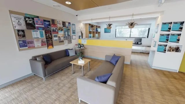 Two grey couches and a coffee table communal area living room at Western Sydney University Penrith Village in Sydney Student Accommodation
