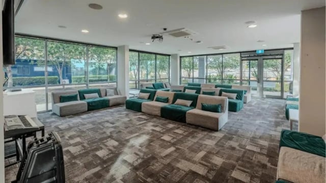 Sofa seating with projector and keyboard common area at Western Sydney University Penrith Village in Sydney Student Accommodation