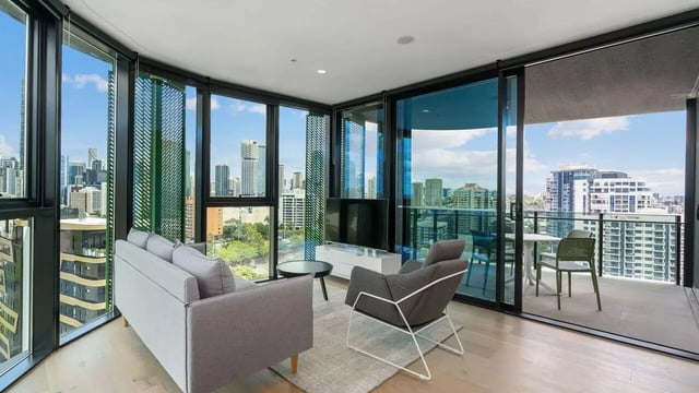 Sofa chair TV balcony with city view Living room at Realm Kangaroo Point in Brisbane Student Accommodation