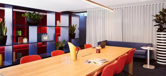 Conference table with chairs and laptop Study area at Scape Aurora in Melbourne Student Accommodation
