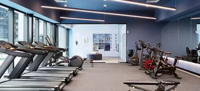 Treadmills ellipticals exercise bikes gym room at Scape Aurora in Melbourne Student Accommodation