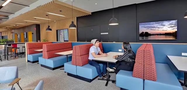 Booth seating with two students studying common area at Scape Darling House in Sydney Student Accommodation