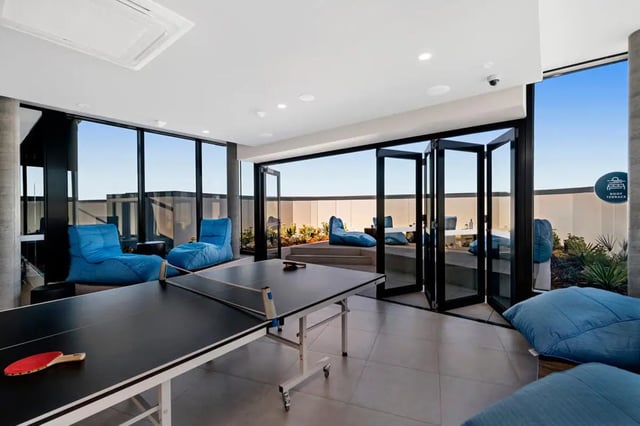 Ping pong table blue beanbags modern living area at Scape Peel in Melbourne Student Accommodation