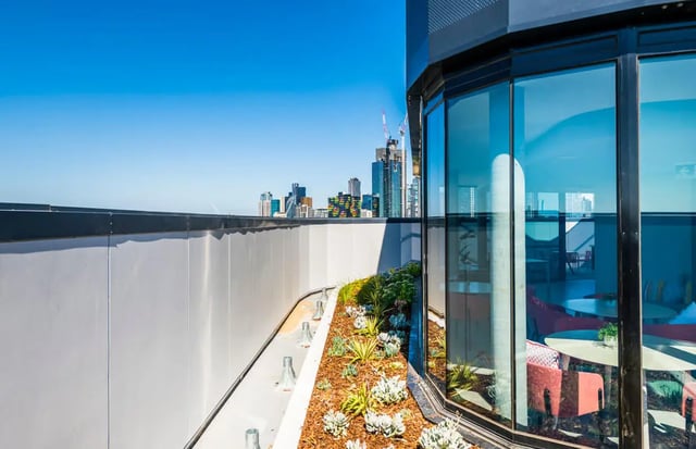 Rooftop garden seating and city view exterior at Scape Peel in Melbourne Student Accommodation