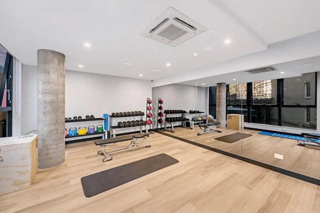 Dumbbells kettlebells benches and mats gym. at Scape Peel in Melbourne Student Accommodation