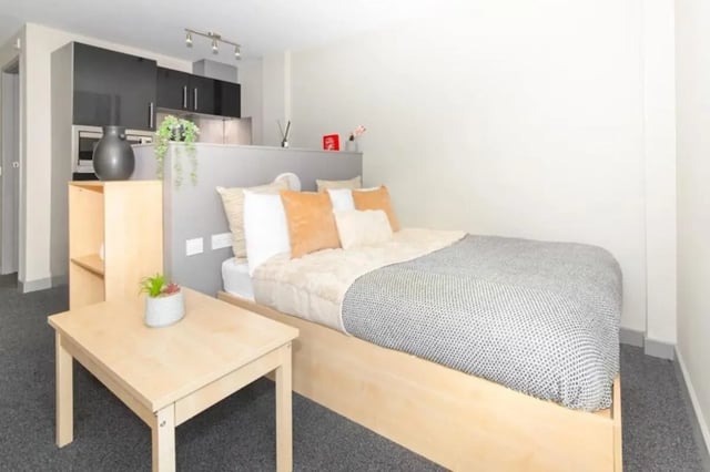 Bed with kitchen area and table bedroom at Studio 58 in Bristol Student Accommodation