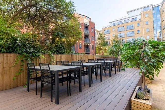 Outdoor dining tables and chairs courtyard exterior at Studio 58 in Bristol Student Accommodation