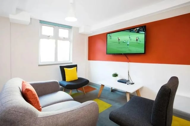 Sofa chairs coffee table television living room at St Martins House in Leicester Student Accommodation