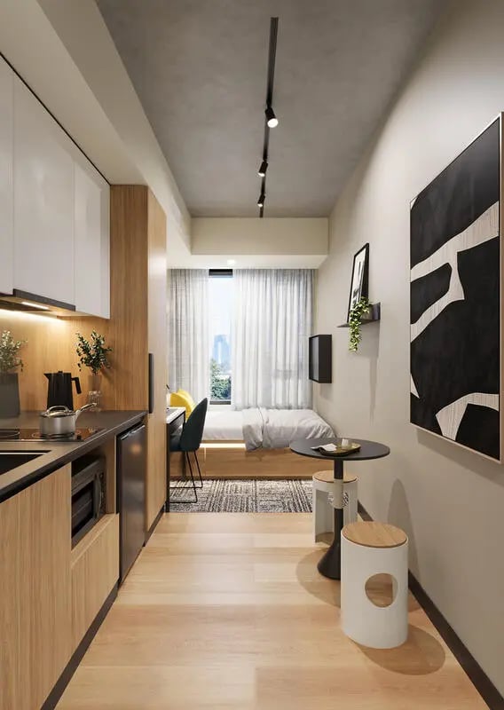 Kitchen bed desk and chairs studio apartment at EPIISOD Macquarie Park in Sydney Student Accommodation