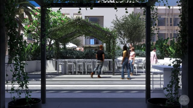 People walking by white tables and chairs outside living area at EPIISOD Macquarie Park in Sydney Student Accommodation