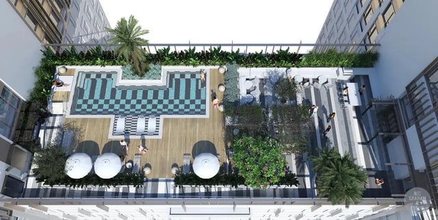 Pool lounge area with tables and trees exterior at EPIISOD Macquarie Park in Sydney Student Accommodation