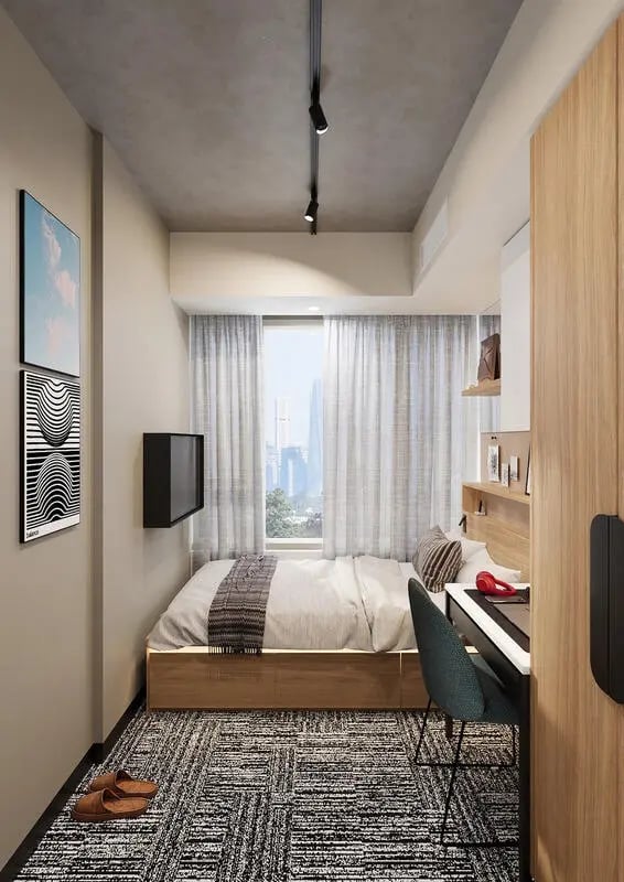 Bed desk and artwork in student bedroom at EPIISOD Macquarie Park in Sydney Student Accommodation