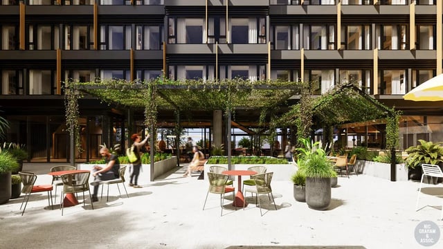 Student housing courtyard with tables chairs and plants exterior at EPIISOD Macquarie Park in Sydney Student Accommodation