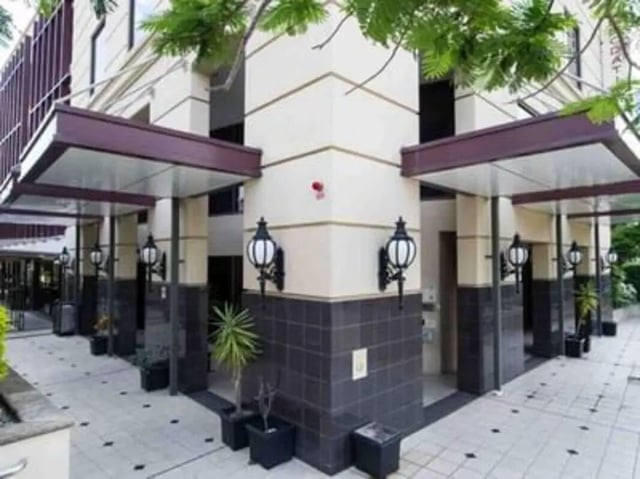 Exterior awnings wall lamps and potted plants exterior at Student Living - Shafston in Brisbane Student Accommodation
