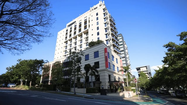 Tall building with windows and balconies exterior at Student Living - Shafston in Brisbane Student Accommodation