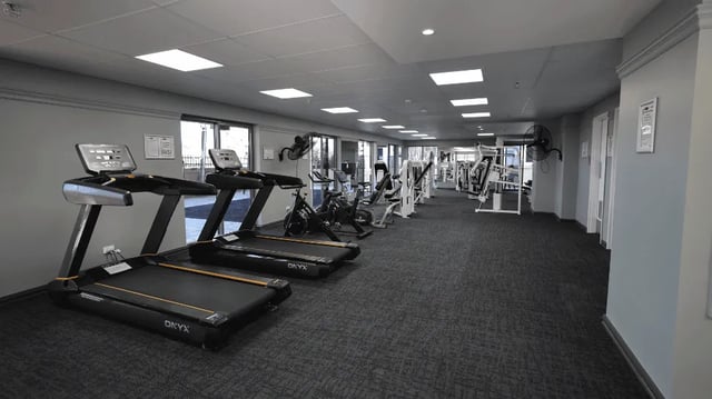 Treadmills exercise bikes and weight machines gym at Student Living - Shafston in Brisbane Student Accommodation