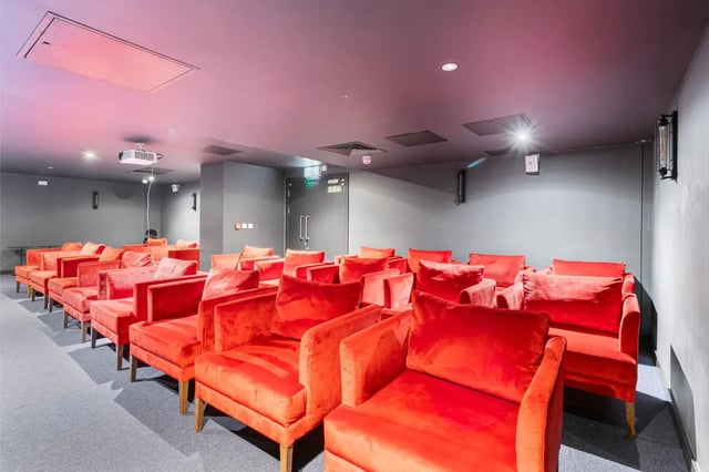 Red plush chairs arranged in rows cinema at Chapter Kings Cross in London Student Accommodation