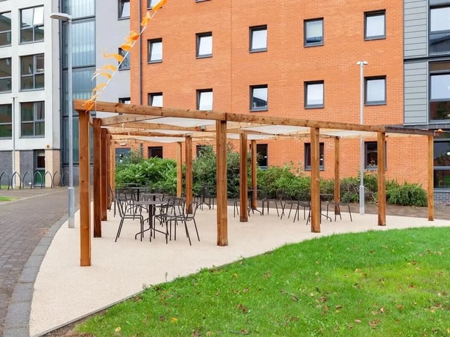 Pergola with tables and chairs exterior at The Forge in Sheffield Student Accommodation