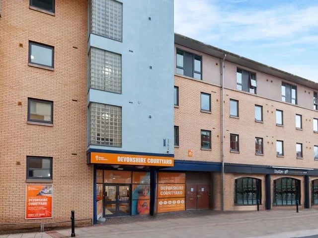 Brick building windows and signage exterior at Devonshire Courtyard in Sheffield Student Accommodation