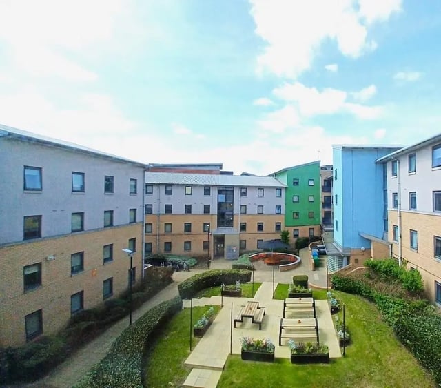 Buildings with courtyard seating exterior at Devonshire Courtyard in Sheffield Student Accommodation