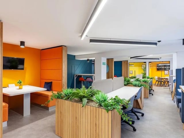 Study area with desks plants and seating living room at Devonshire Courtyard in Sheffield Student Accommodation