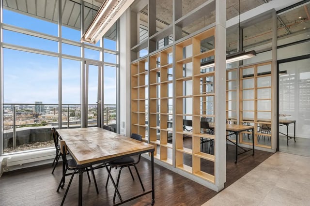Table chairs and shelves with city view Study area at Chapter Aldgate in London Student Accommodation