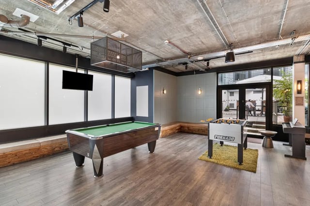 Billiard table foosball table piano playing area at Chapter Aldgate in London Student Accommodation