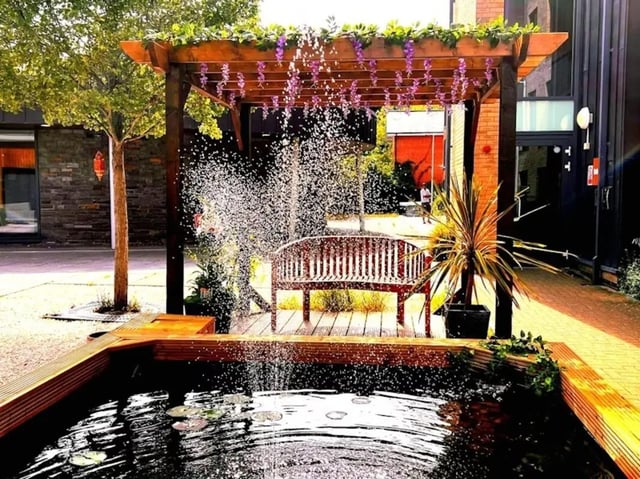 Pergola water feature wooden bench outdoor area at Kendrick Hall in Reading Student Accommodation