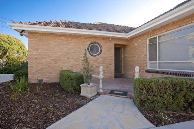 Brick house with entryway and landscaping exterior at Classical House in Melbourne Student Accommodation