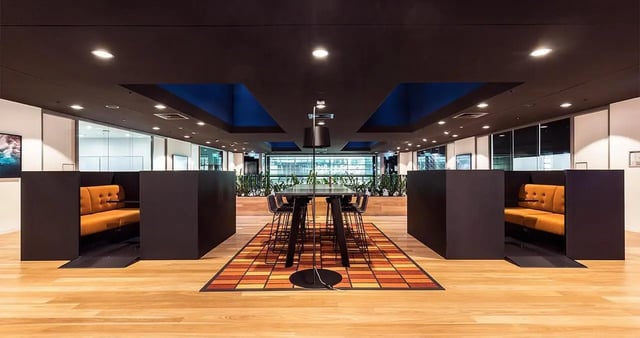 Study pods with orange seating and large table at Iglu Central Park in Sydney Student Accommodation
