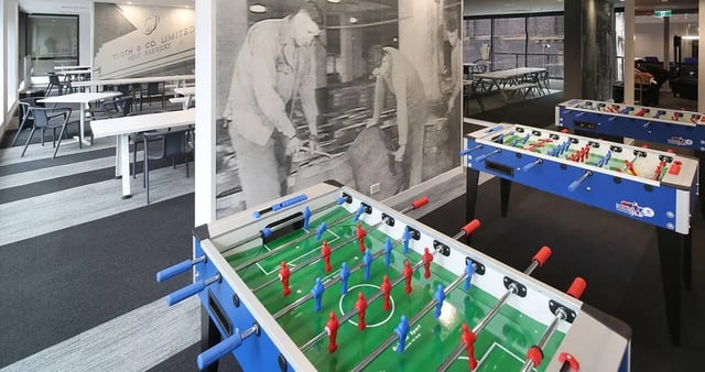 Foosball tables and seating area common room at Iglu Central Park in Sydney Student Accommodation