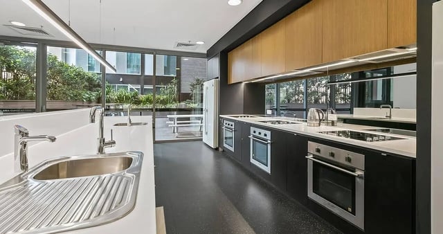 Modern kitchen with sinks ovens fridge kitchen at Iglu Central Park in Sydney Student Accommodation