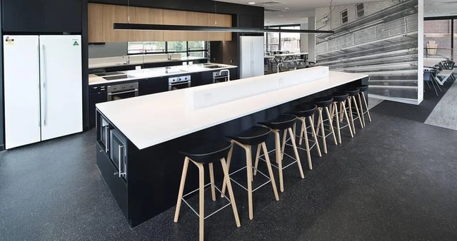 Kitchen with island bar stools and refrigerators Kitchen at Iglu Central Park in Sydney Student Accommodation