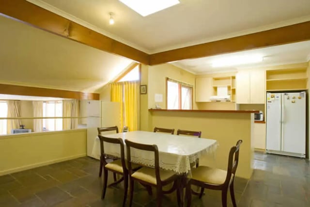 Dining table with chairs kitchen area living room at Greenwood House in Melbourne Student Accommodation