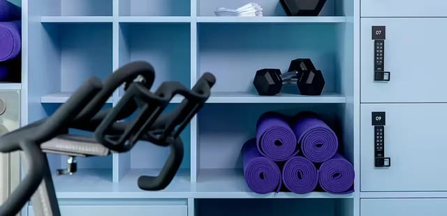 Spin bike dumbbells yoga mats lockers facility area at Scape Aurora in Melbourne Student Accommodation