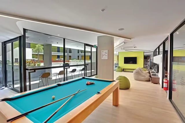 Pool table bar stools and bean bags lounge area at Scape Glebe in Sydney Student Accommodation