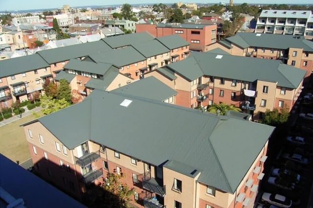Apartment buildings with grey roofs and balconies exterior at Sydney University Village in Sydney Student Accommodation
