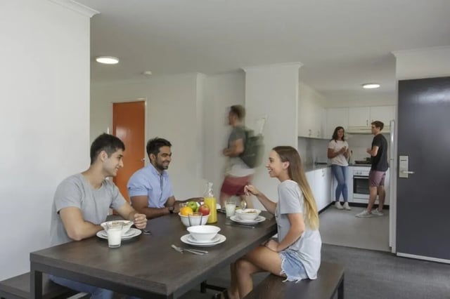 Students eating at a dining table kitchen living room at Student Village North Ryde in Sydney Student Accommodation