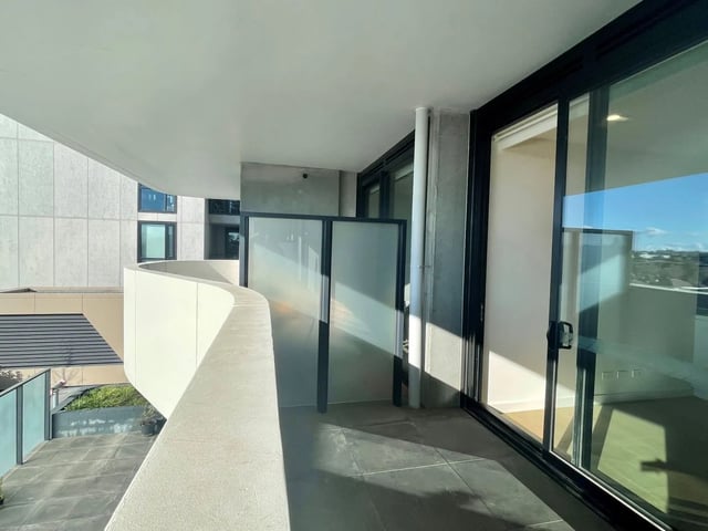 Balcony with frosted glass screens and sliding doors Balcony at BELONG Clayton Melbourne in Melbourne Student Accommodation