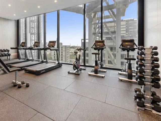 Treadmills exercise bikes dumbbells gym at Belong Melbourne CBD in Melbourne Student Accommodation