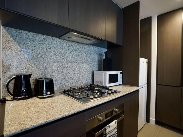 Kettle toaster microwave stove fridge kitchen at Belong Melbourne CBD in Melbourne Student Accommodation