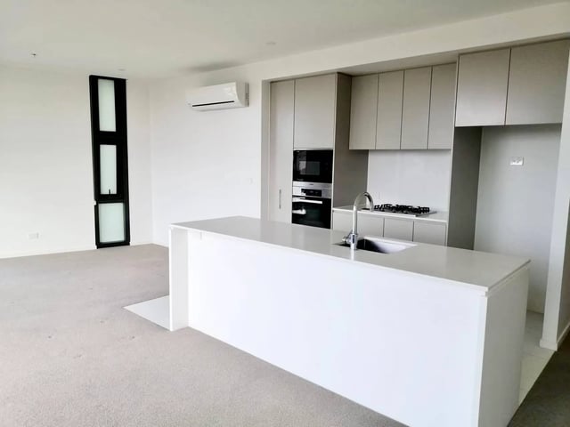 Modern kitchen island with sink and cabinets kitchen at BELONG Newcastle NSW in Newcastle Student Accommodation