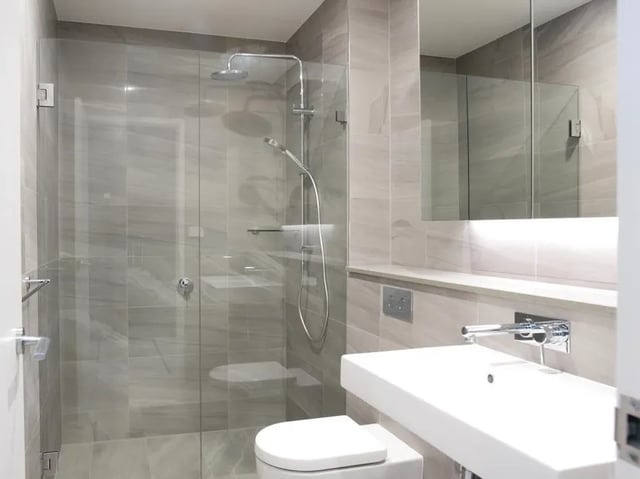Modern bathroom with shower toilet and sink bathroom at BELONG Newcastle NSW in Newcastle Student Accommodation